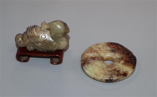 A Chinese archaistic jade bi disc and a grey and black jade phoenix (2)
